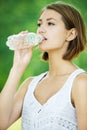 Young woman drinking water bottle Royalty Free Stock Photo