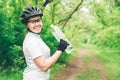 Young woman drinking water after doing some bicycle exercise Royalty Free Stock Photo