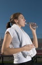 Young woman drinking water after exercising Royalty Free Stock Photo