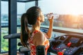 Young woman drinking water in the gym. Exercise concept Royalty Free Stock Photo