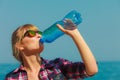 Young woman drinking water outdoor Royalty Free Stock Photo