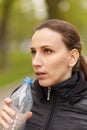 Young woman drinking water after workout jogging Royalty Free Stock Photo