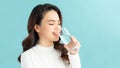 Young woman drinks clean water adheres to drinking regime