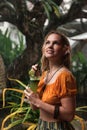 Young woman drinks cocktail in tropical rain Royalty Free Stock Photo