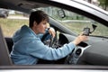 Female Driver Looking for the Way with Navigator Royalty Free Stock Photo