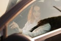 Young woman driving a car in the city. Portrait of a beautiful business woman in a car. Business concept Royalty Free Stock Photo