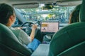 Young woman driving Tesla, Shenzhen China