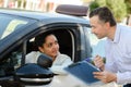 Young woman on driving test with instructor