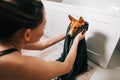 Young woman drying her dog with towel after bathing Royalty Free Stock Photo