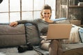 Young woman with dslr photo camera and laptop Royalty Free Stock Photo