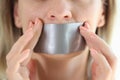 Young woman with duct tape sealed on mouth Royalty Free Stock Photo