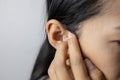 Young woman is suffering of earache