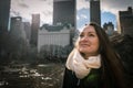 A young woman early in the morning is standing in the central park of New York