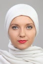 Young woman eastern type in the modern Muslim clothes and beautiful headdress Royalty Free Stock Photo