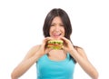 Young woman eat tasty fast food unhealthy burger Royalty Free Stock Photo