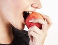 Young woman eating apple