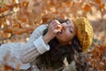 Young woman eating apple outdoor in autumn Royalty Free Stock Photo