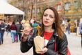 Young Woman Eating Asian Take Out at Busy Festival Royalty Free Stock Photo
