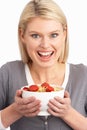 Young Woman Eating Bowl Of Healthy Breakfast Royalty Free Stock Photo