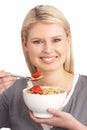 Young Woman Eating Bowl Of Healthy Cereal Royalty Free Stock Photo