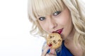 Young Woman Eating a Chocolate Chip Cookie Biscuit Royalty Free Stock Photo