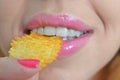 Young woman eating crisps Royalty Free Stock Photo