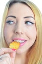 Young woman eating crisps Royalty Free Stock Photo