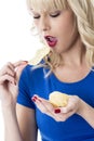 Young Woman Eating Crisps Royalty Free Stock Photo