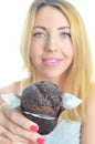 Young woman eating cupcake Royalty Free Stock Photo