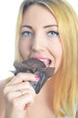 Young woman eating cupcake Royalty Free Stock Photo