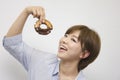 Young woman eating doughnut Royalty Free Stock Photo