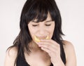 Young woman is eating fresh citrus fruit Royalty Free Stock Photo