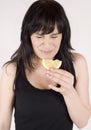 Young woman is eating fresh citrus fruit Royalty Free Stock Photo