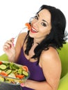 Young Woman Eating a Fresh Crisp Mixed Garden Salad Royalty Free Stock Photo