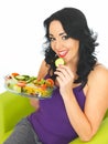 Young Woman Eating a Fresh Crisp Mixed Garden Salad Royalty Free Stock Photo