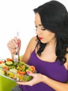 Young Woman Eating a Fresh Crisp Mixed Garden Salad Royalty Free Stock Photo