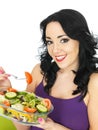 Young Woman Eating a Fresh Crisp Mixed Garden Salad