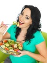 Young Woman Eating a Fresh Crisp Mixed Garden Salad Royalty Free Stock Photo