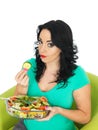 Young Woman Eating a Fresh Crisp Mixed Garden Salad Royalty Free Stock Photo