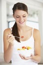 Young Woman Eating Fresh Fruit Salad Royalty Free Stock Photo