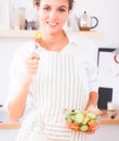 Young woman eating fresh salad in modern kitchen Royalty Free Stock Photo