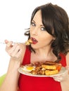 Young Woman Eating a Full English Breakfast Royalty Free Stock Photo