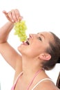 Young woman eating grapes Royalty Free Stock Photo