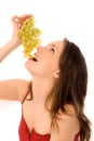 Young woman eating grapes Royalty Free Stock Photo