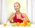 Young woman eating healthy breakfast Royalty Free Stock Photo