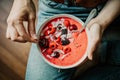 Woman eating healthy smoothie bowl Royalty Free Stock Photo