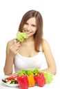 Young woman eating healthy salad on white Royalty Free Stock Photo