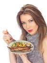 Young Woman Eating Mackerel and Salad