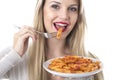 Young Woman Eating Penne Pasta