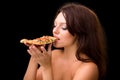 Young woman eating a piece of pizza Royalty Free Stock Photo